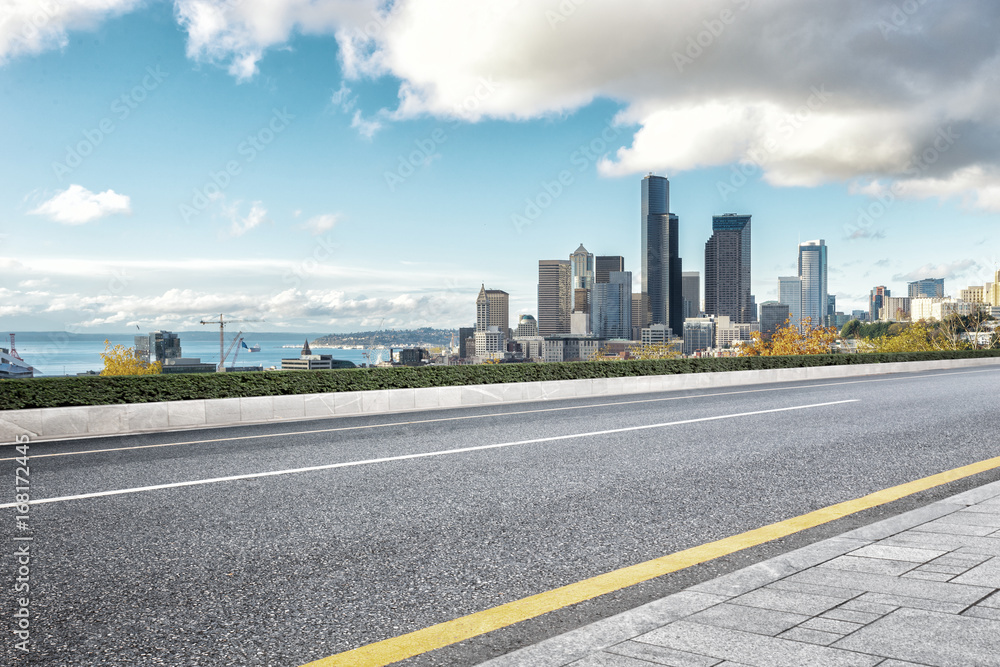 empty road with cityscape of modern city empty road with cityscape of modern city