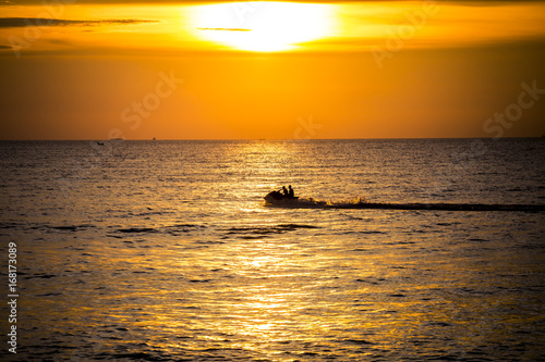 Silhouette of jetski at sunset