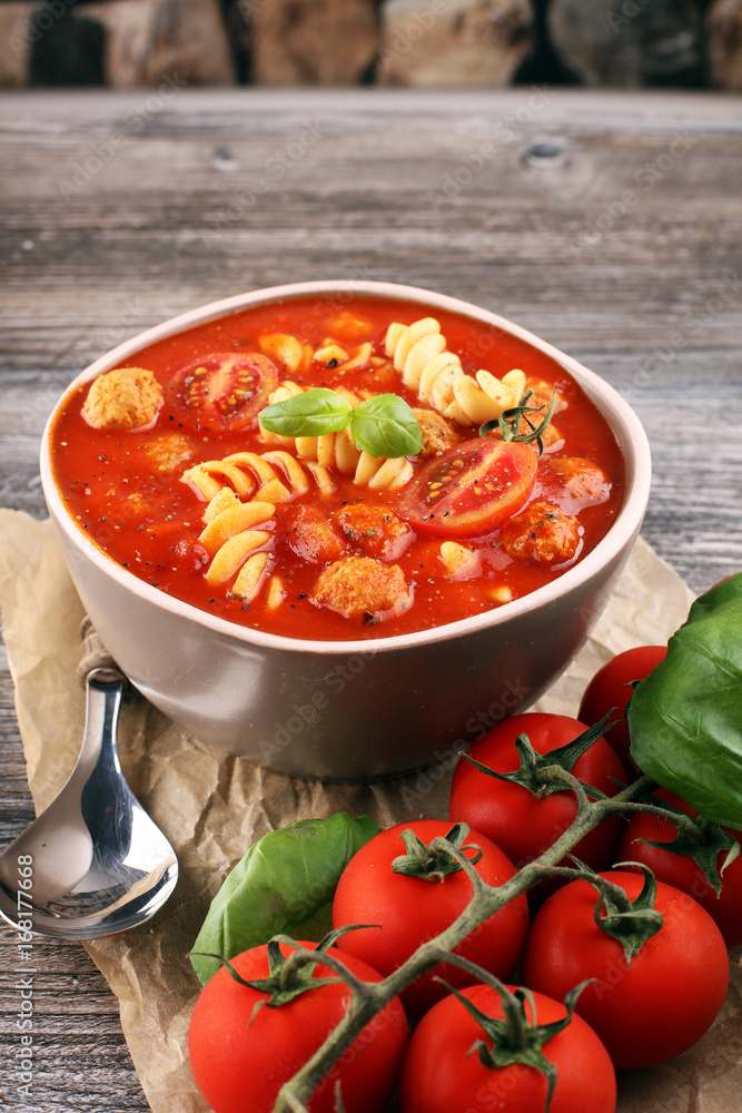 Tomato soup with meatballs in a bowl. Italian minestrone soup Tomato soup with meatballs in a bowl. Italian minestrone soup