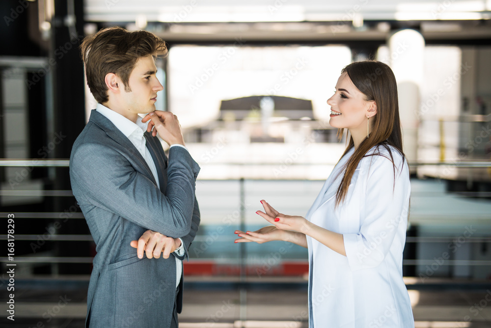 team of successful business people. two businessmen resting and talking in the office. man and woman informan meeting of the business center. team of successful business people. two businessmen resting and talking in the office. man and woman informan meeting of the business center.