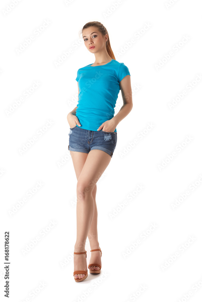 Girl in a T-shirt and shorts on a white background Girl in a T-shirt and shorts on a white background