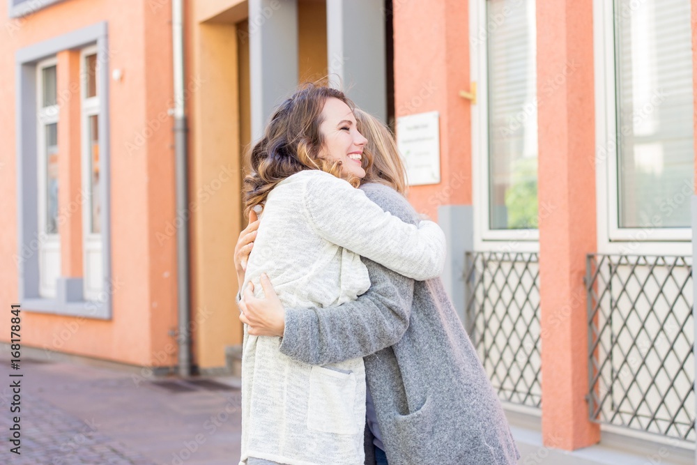 Two friends walk through the city. Communication. Warm spring. Summer. Two friends walk through the city. Communication. Warm spring. Summer.