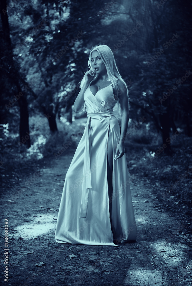 Girl in a long dress in the park. Blonde. Summer. Girl in a long dress in the park. Blonde. Summer.