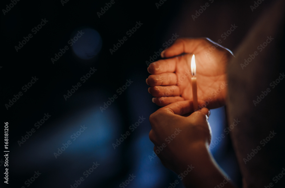 Bride holds little candle in her arms