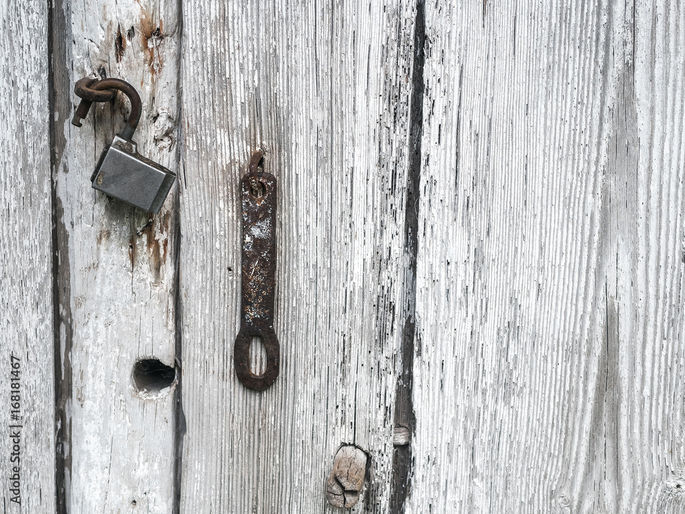 White wood plank texture background. Old rusty lock. White wood plank texture background. Old rusty lock.