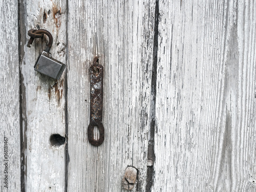 White wood plank texture background. Old rusty lock. © luckykot