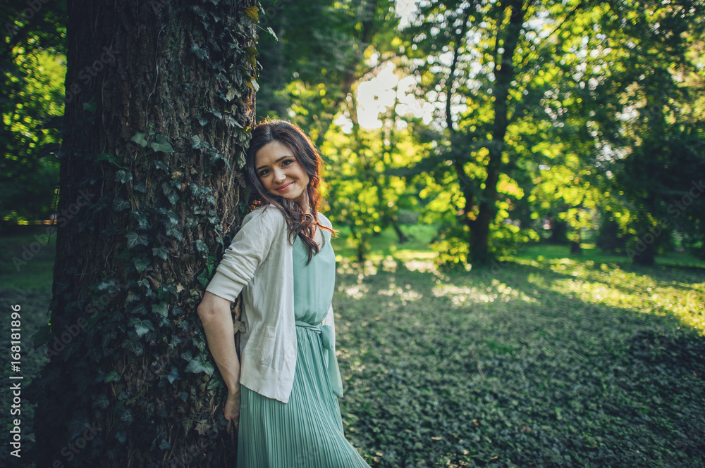Happy Lifestyle portrait of a beautiful young model girl walking in the park Happy Lifestyle portrait of a beautiful young model girl walking in the park