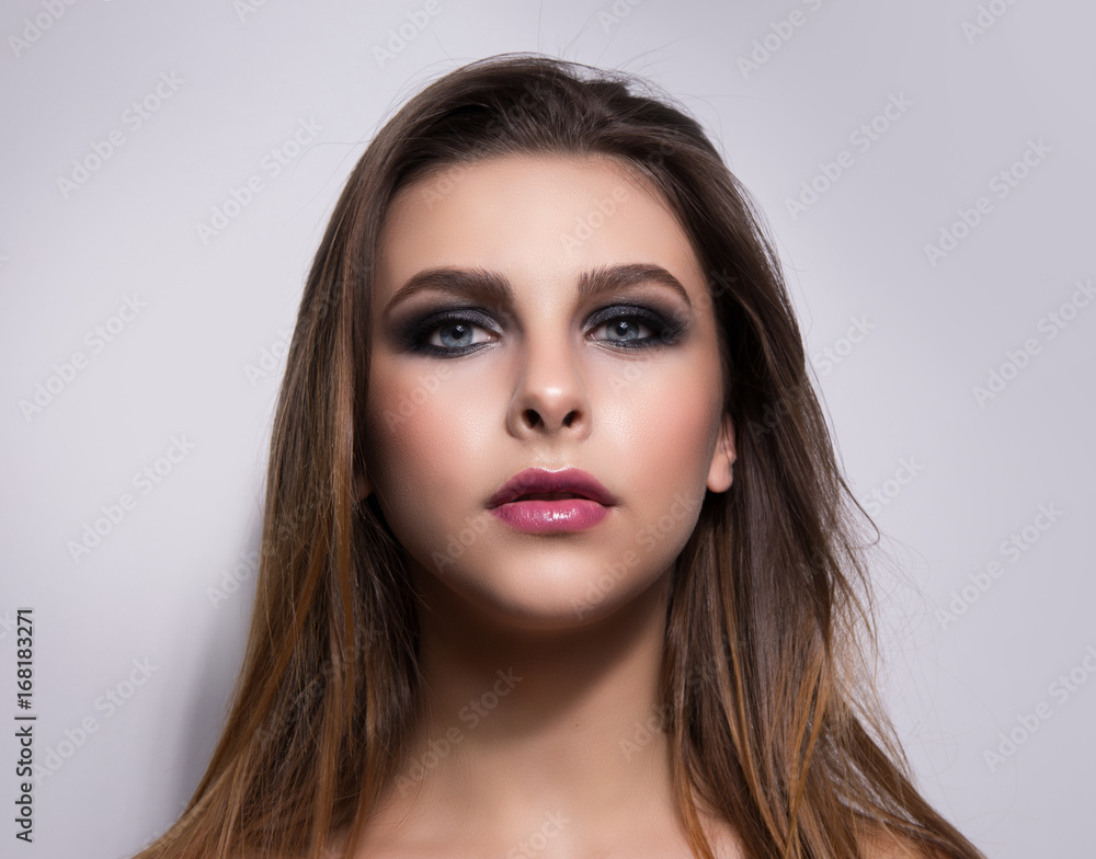 Fashionable portrait of a girl model. Fashion, smoky eyes makeup. Fashionable portrait of a girl model. Fashion, smoky eyes makeup.
