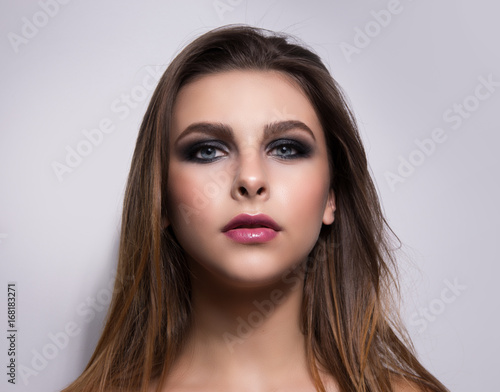 Fashionable portrait of a girl model. Fashion, smoky eyes makeup.