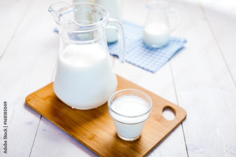 milk and glasses of milk on a wooden rustic table. milk and glasses of milk on a wooden rustic table.