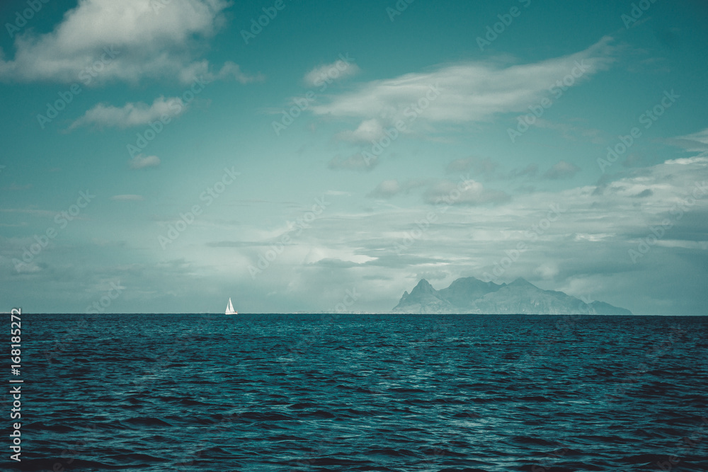 A romantic landscape that reflects peace and proud loneliness. White sail against the background of the endless sea of Norway and the clouds. By Letowa. A romantic landscape that reflects peace and proud loneliness. White sail against the background of the endless sea of Norway and the clouds. By Letowa.