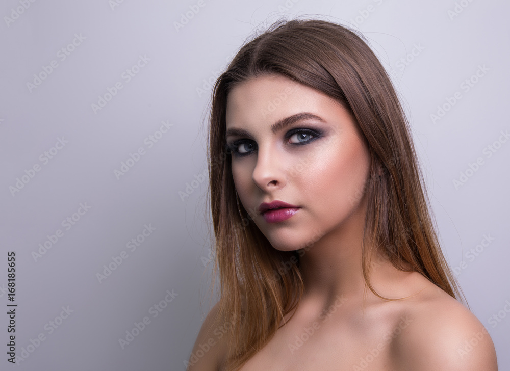 Fashionable portrait of a girl model. Fashion, smoky eyes makeup. Fashionable portrait of a girl model. Fashion, smoky eyes makeup.