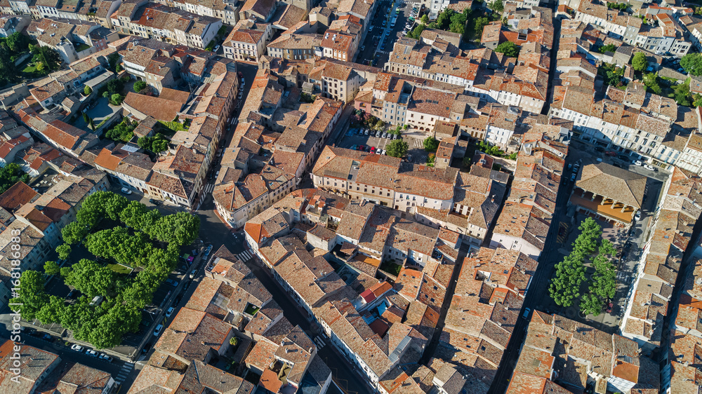 Aerial top view of residential area houses roofs and streets from above, medieval town background
