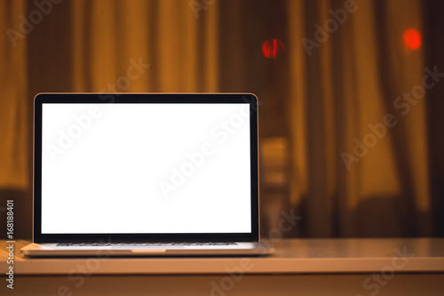 Laptop on a table at night.