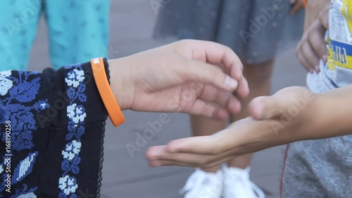 Children shake hands with each other