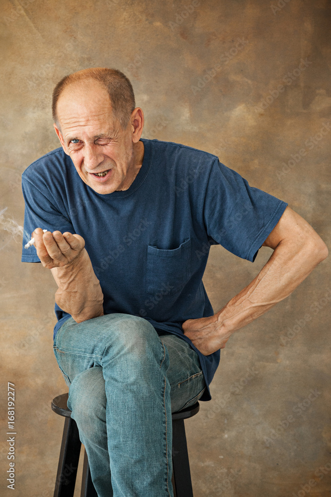 Worried mature man sitting at studio Worried mature man sitting at studio
