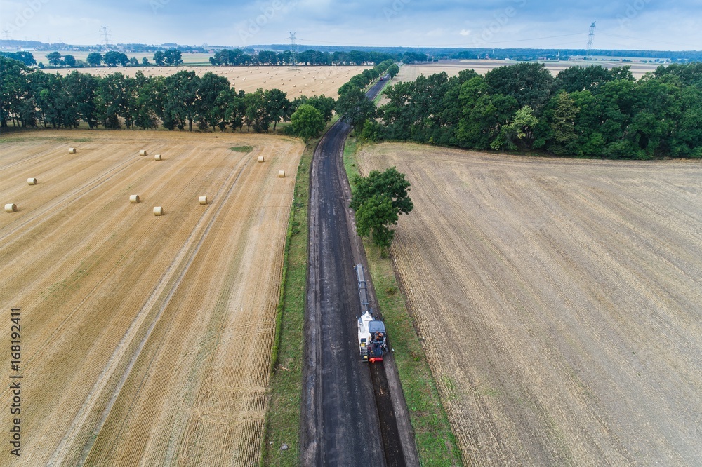 Fototapeta premium Aerial view on working asphalt scrapping machine