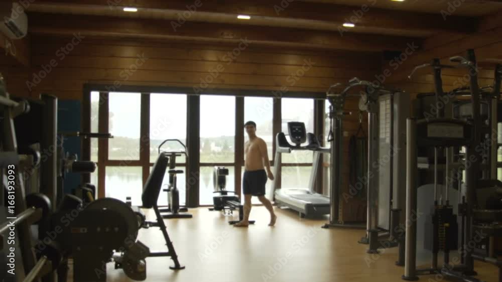 Young man jogging in the gym Young man jogging in the gym