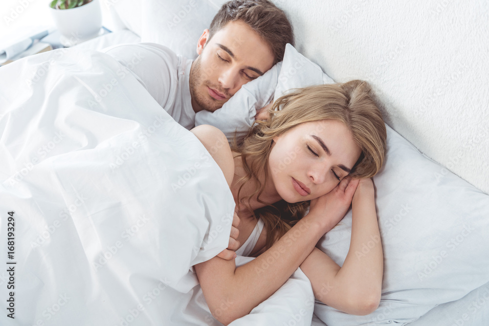 couple sleeping in bed couple sleeping in bed