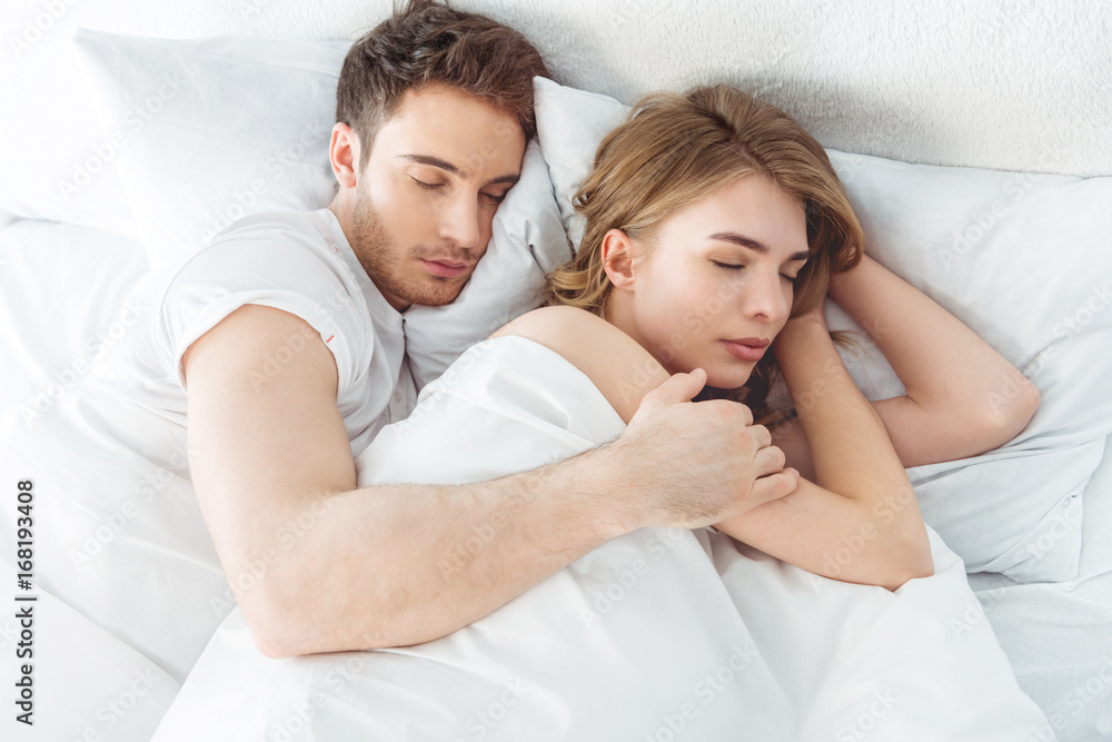 couple sleeping in bed