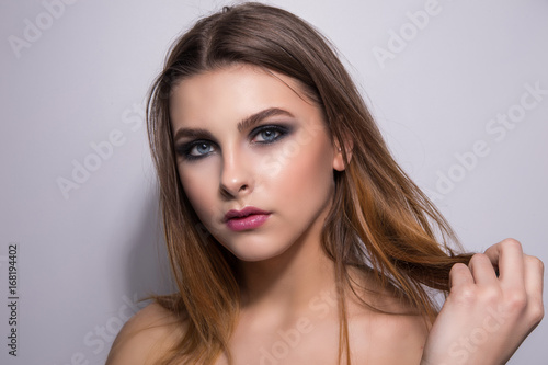Fashionable portrait of a girl model. Fashion, smoky eyes makeup.