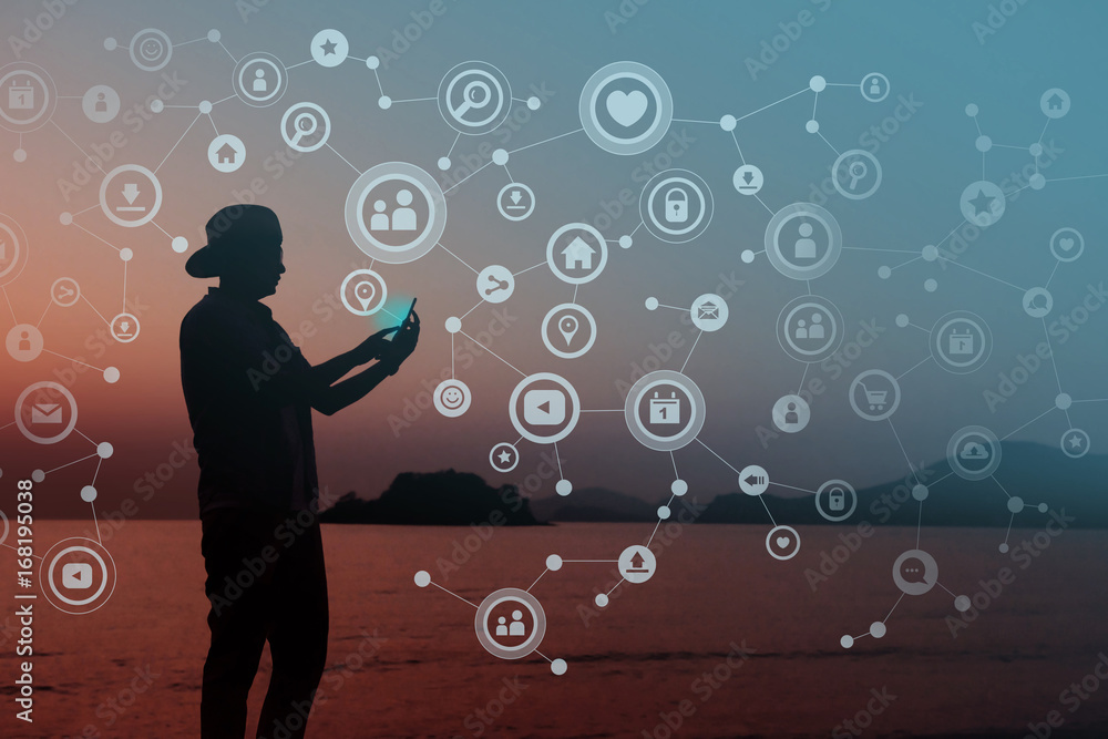 Always Connected concept, Silhouette of Young human using smart phone to Communicate in Network, Beach or Countryside as background Always Connected concept, Silhouette of Young human using smart phone to Communicate in Network, Beach or Countryside as background