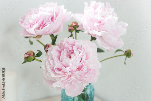 Bouquet of pink peonies in a vase. Bouquet of peonies in a vase on the table. Dressing table.