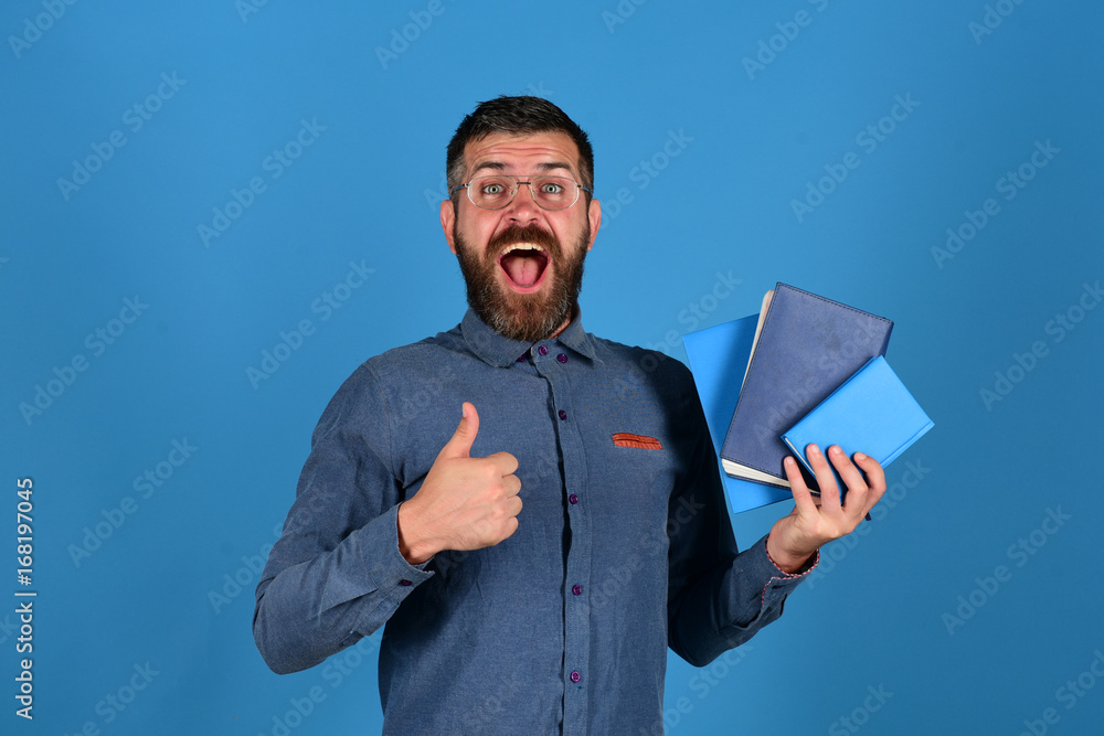 Professor with very happy face. Man with beard and books Professor with very happy face. Man with beard and books