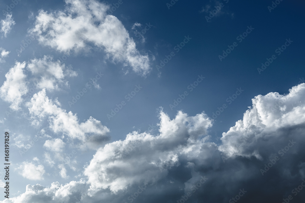 Sky blue, clouds with deep shadows, pre-storm clouds Sky blue, clouds with deep shadows, pre-storm clouds