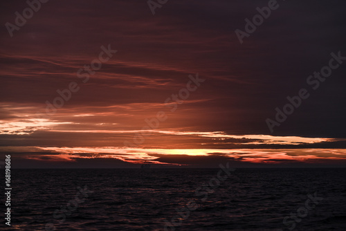 Beautiful red sunrise in the northern summer sea