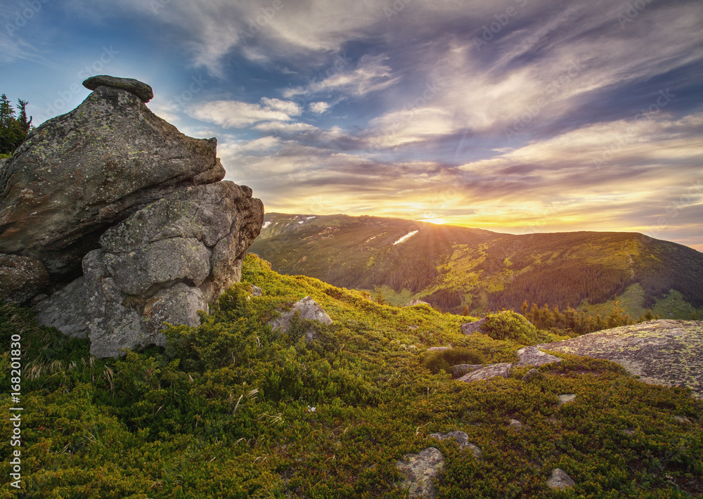 Sunrise in rocky mountains. Magical landscape