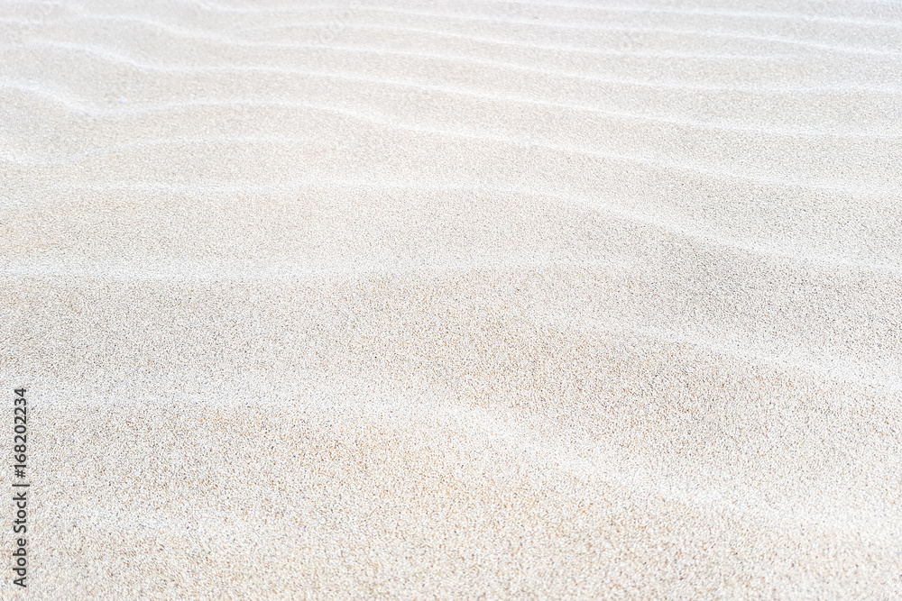 Sand on the beach as a background. - obrazy, fototapety, plakaty 