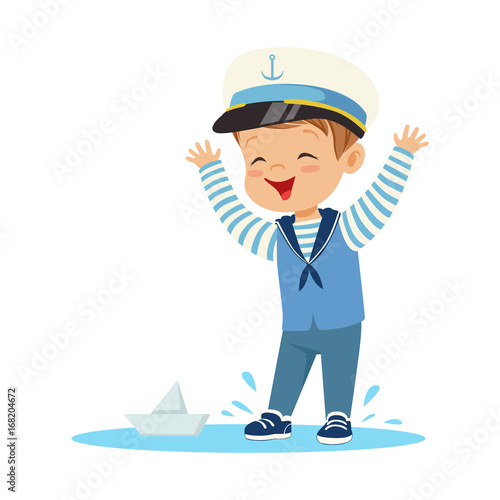 Cute smiling little boy character wearing a sailors costume standing in a puddle playing with paper boat colorful vector Illustration