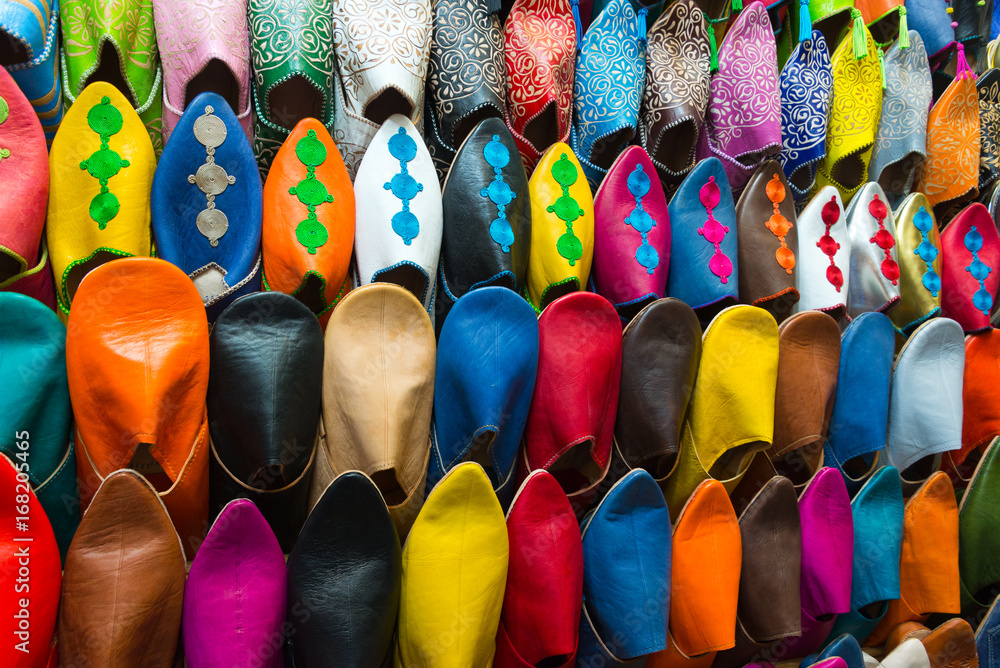 assorted shoes at market stall in morocco