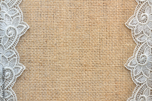 Large lace at left and right on a burlap