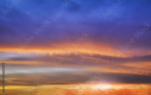 incredibly beautiful sunset, clouds at sunset, colorful sunset © Panya Studio