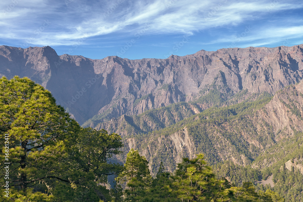 Caldera de Taburiente National park, view over pine trees to surrounding mountains in warm evening light, Isle of La Palma, Canary Islands, Spain, Europe