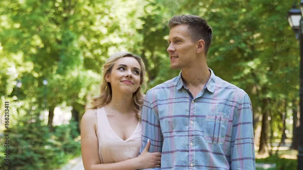 Beautiful blonde lady admiring her successful self-confident boyfriend on date Beautiful blonde lady admiring her successful self-confident boyfriend on date