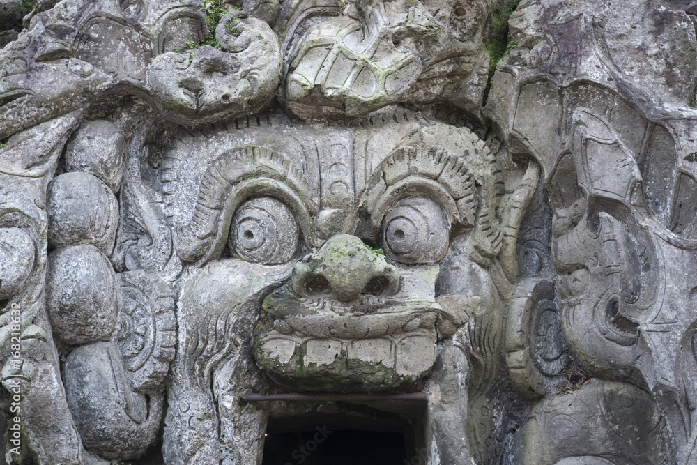 Stone Spirit at entrance of Goa Gajah Cave, Ubud, Bali Indonesia