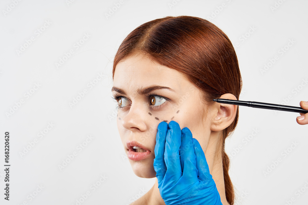 Woman on a light background, portrait, plastic surgery