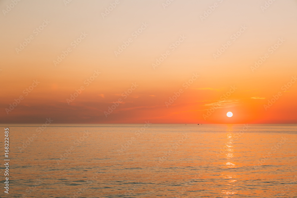 Sun Is Rising On Horizon At Sunset Or Sunrise Over Evening Sea Or Morning Ocean