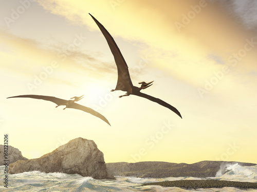 Pteranodones volando sobre rocas en el mar