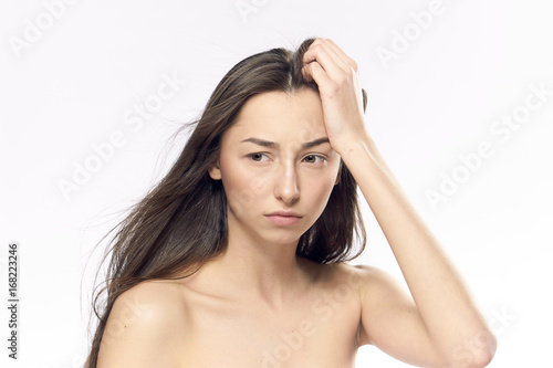 Young beautiful woman on white isolated background, portrait, emotions
