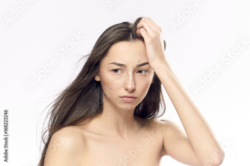 Young beautiful woman on white isolated background, portrait, emotions © SHOTPRIME STUDIO