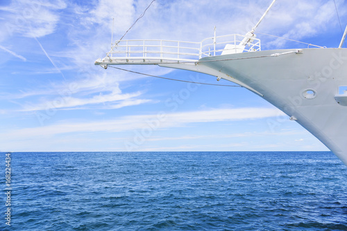 The nose of a beautiful white ship on the sea.