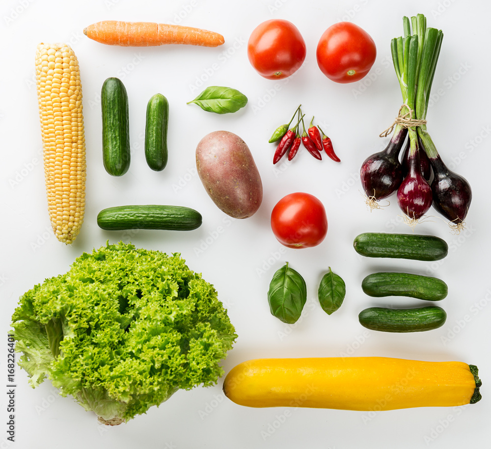 Different tasty fresh vegetables on White Backrgound Top View Different tasty fresh vegetables on White Backrgound Top View