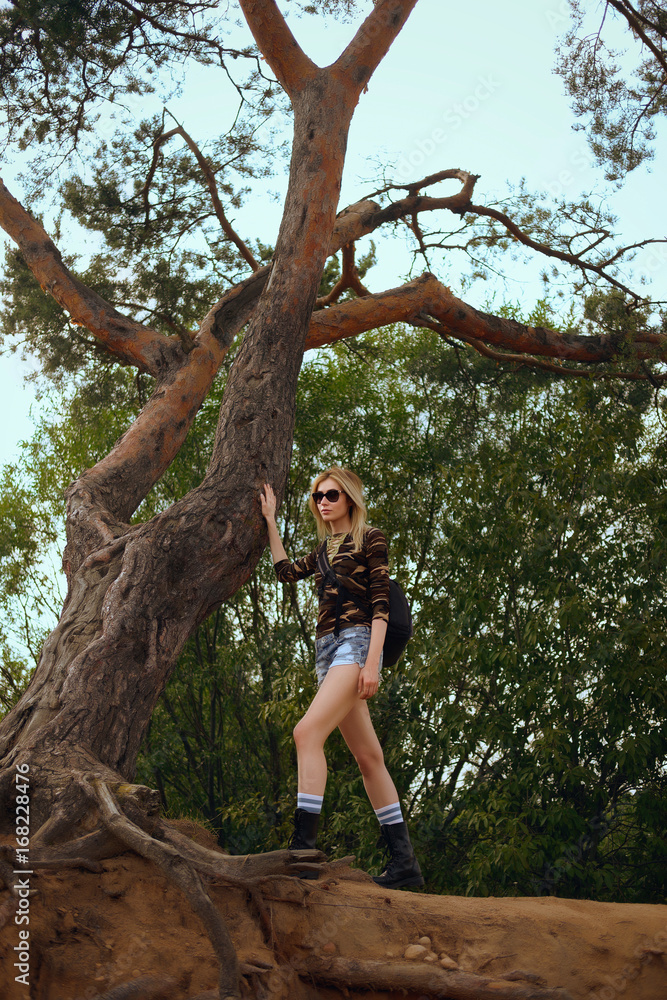 Fototapeta premium Pretty hiker is looking for a trail