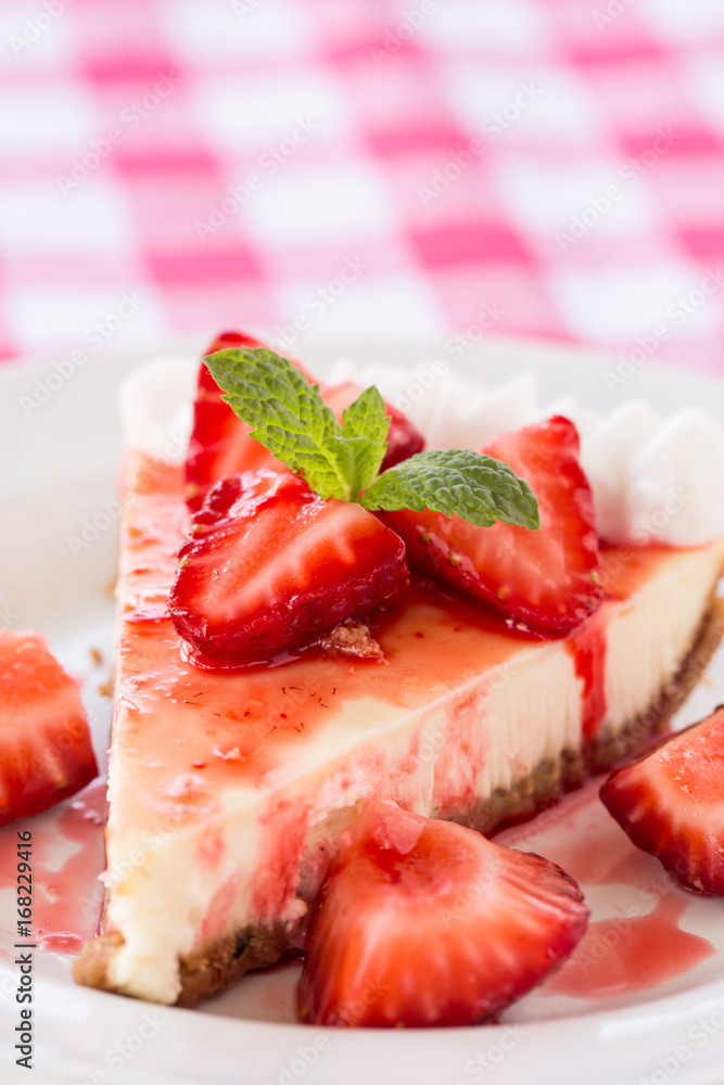 Slice of Fresh Cheesecake With Strawberries and Mint Leaf Slice of Fresh Cheesecake With Strawberries and Mint Leaf