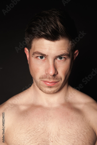 Portrait of sporty man. Caucasian male model in studio shoot.