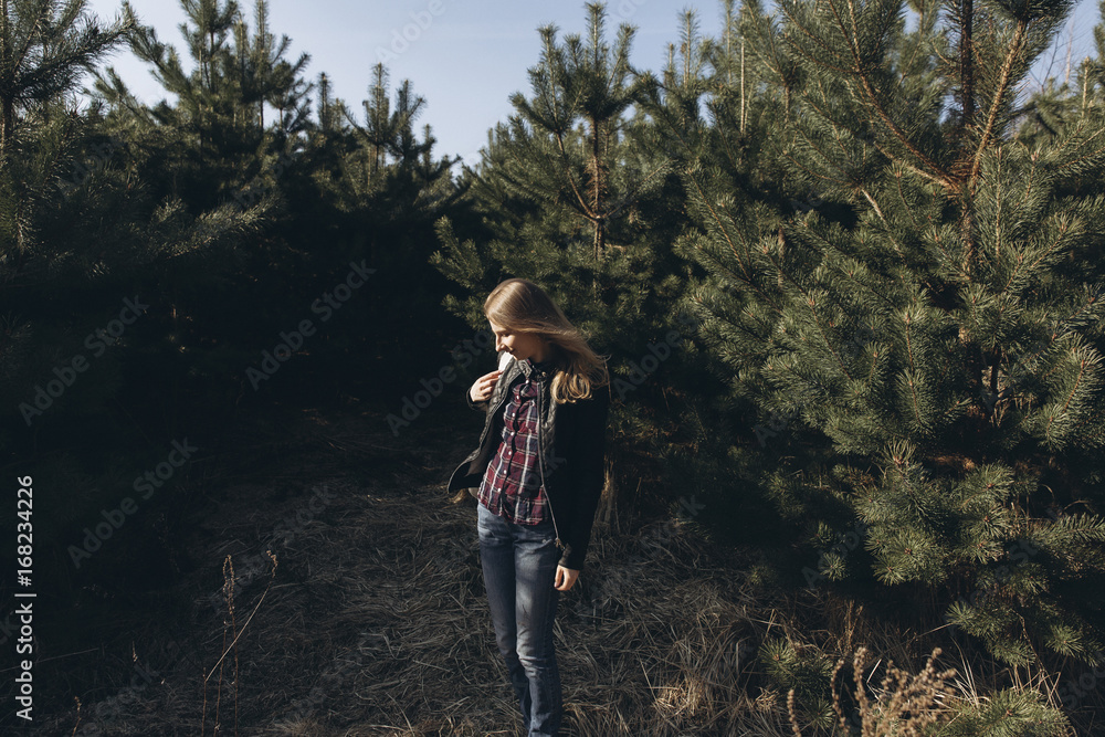 Woman standing in forest